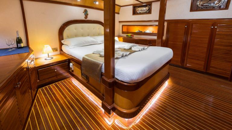 Yacht charter with master cabin. Spacious wooden room